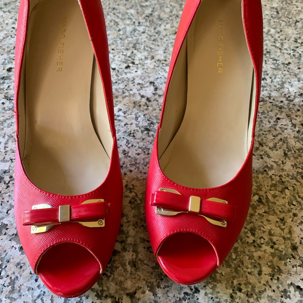 Cute and stylish pumps. Hardly worn. Look brand new except for the soles.